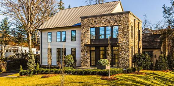 The narrow lot size and tall trees mask a large, open concept home structured to bring in natural light.